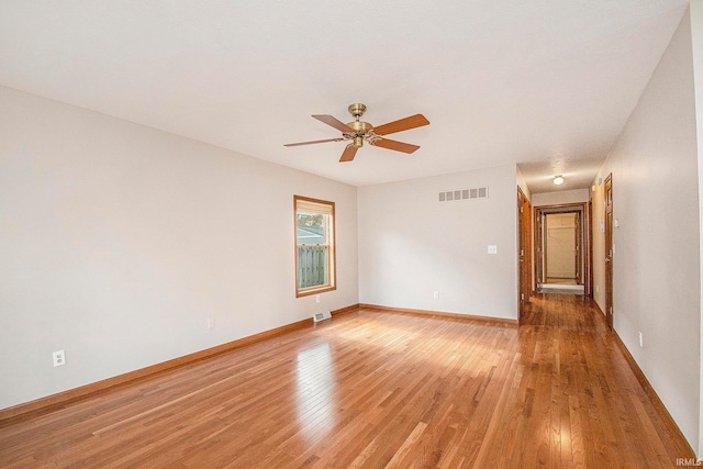 spare room featuring ceiling fan and wood-type flooring