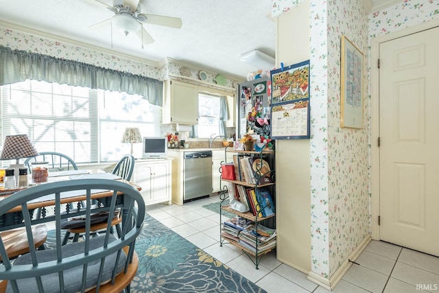 kitchen with dishwasher, a textured ceiling, ceiling fan, and light tile patterned flooring