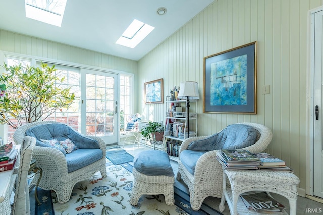 living area featuring wood walls and vaulted ceiling