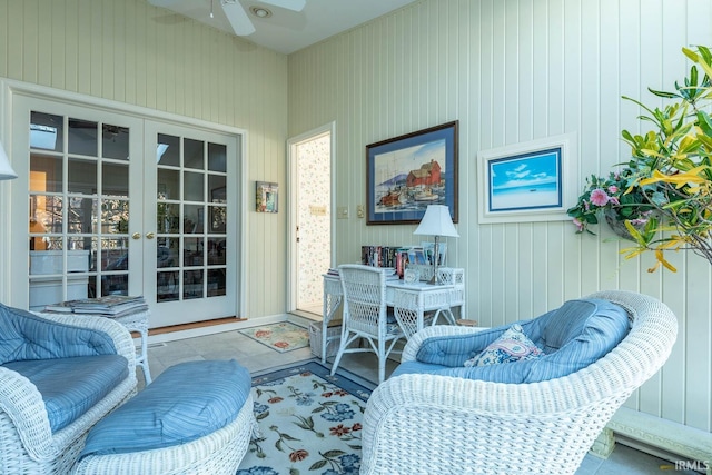 sunroom with ceiling fan and french doors