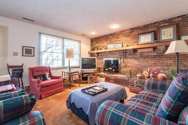 living room featuring carpet, a textured ceiling, a brick fireplace, and brick wall