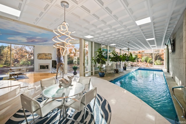 view of pool featuring a chandelier