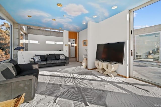 living room featuring light carpet and floor to ceiling windows