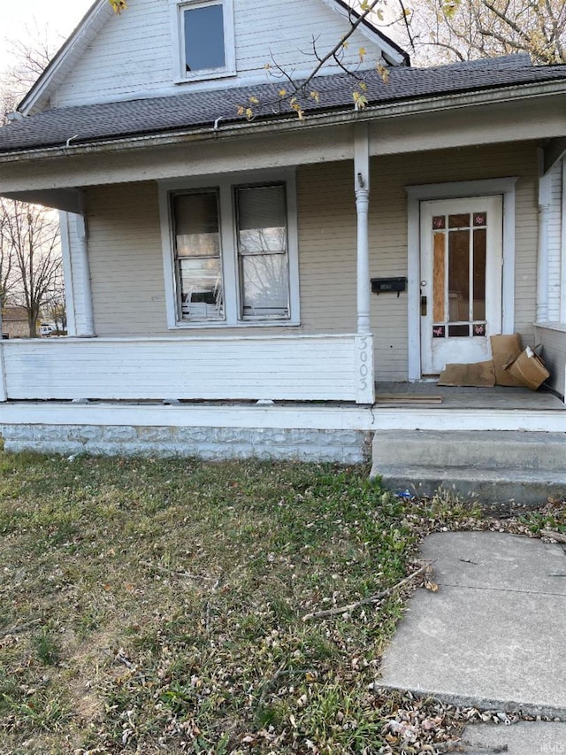 doorway to property featuring covered porch