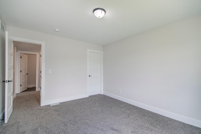 unfurnished bedroom featuring light carpet