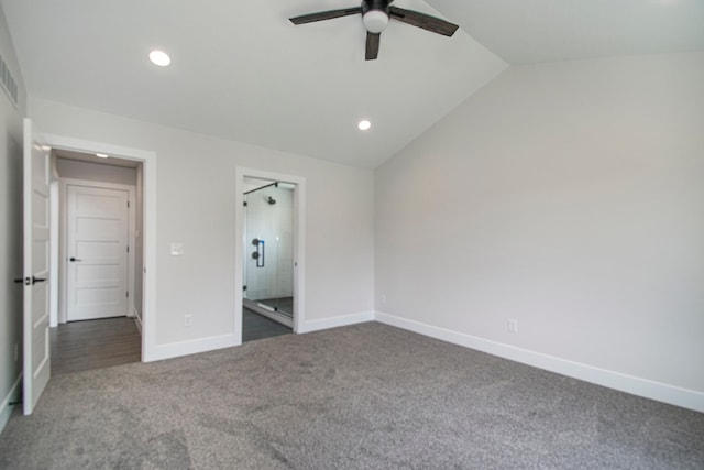 unfurnished bedroom featuring ceiling fan, dark carpet, and vaulted ceiling