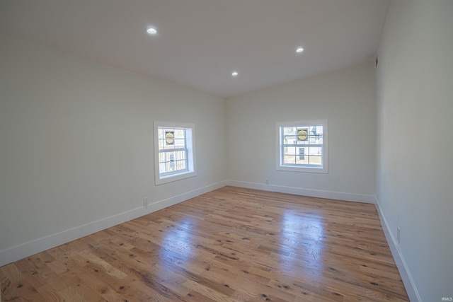 empty room with a healthy amount of sunlight and light wood-type flooring