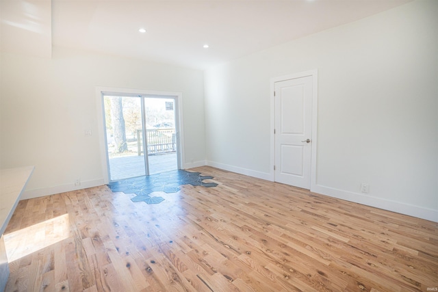 empty room with light hardwood / wood-style floors