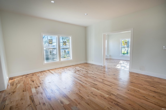 unfurnished room featuring light hardwood / wood-style flooring