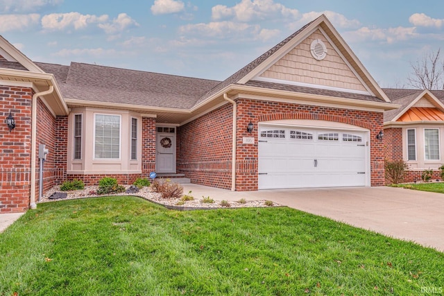 view of front of home with a front lawn and a garage