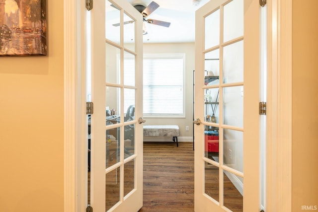 entryway with ceiling fan, dark hardwood / wood-style floors, and french doors