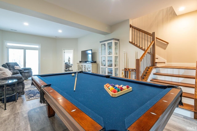 game room with wood-type flooring and pool table