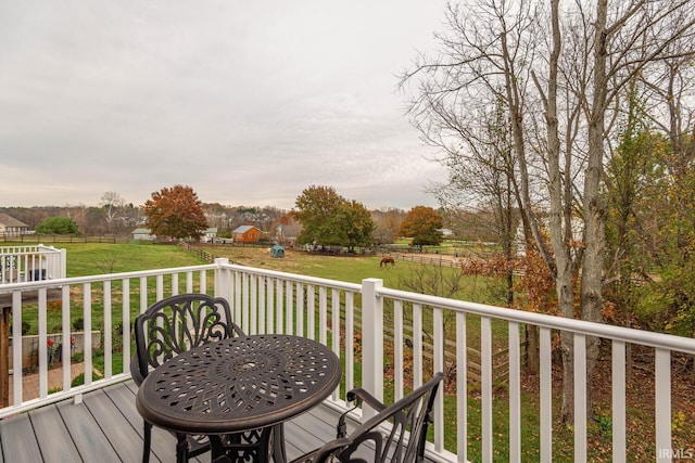 wooden terrace with a lawn