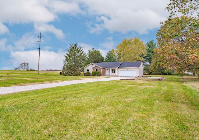 view of front of house with a front lawn and a garage