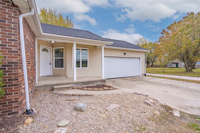 view of front facade featuring a porch and a garage