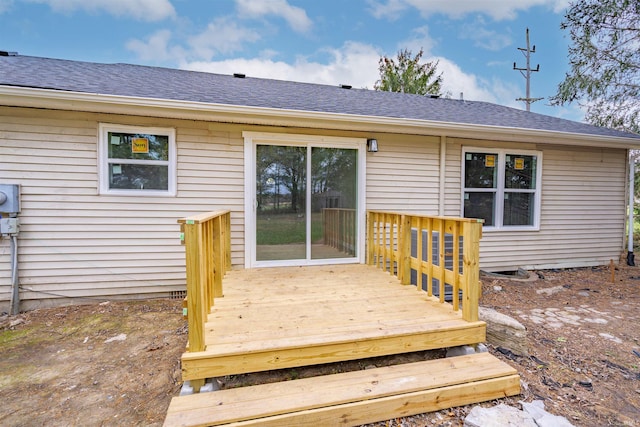 rear view of property with a deck