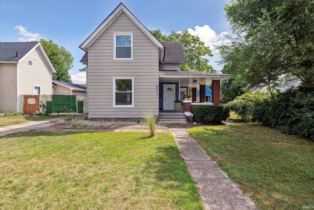 view of front facade with a porch and a front yard