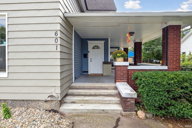 doorway to property featuring covered porch