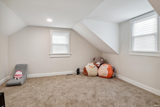 game room featuring carpet flooring and vaulted ceiling