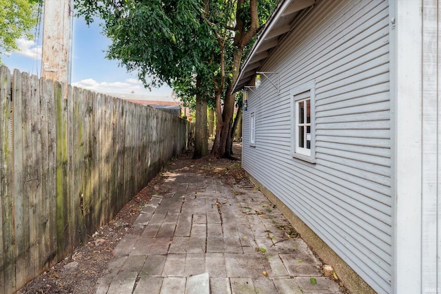 view of side of home with a patio area