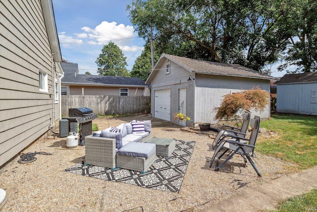 view of patio featuring area for grilling, an outdoor structure, and a garage