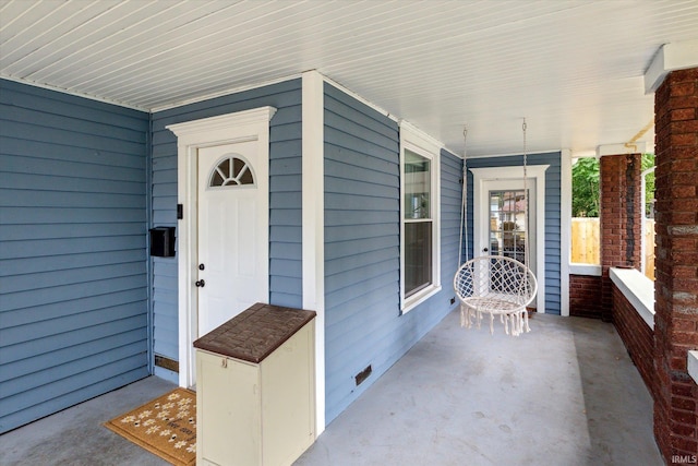 doorway to property with a porch