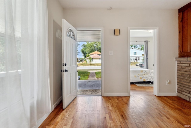 foyer entrance with light hardwood / wood-style flooring