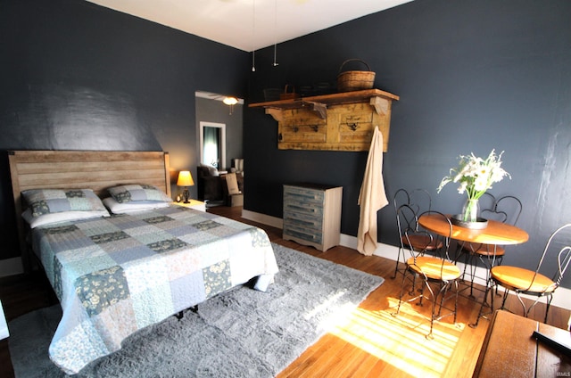 bedroom with wood-type flooring