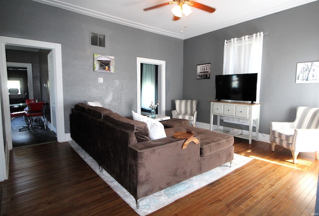 living room with ceiling fan, dark wood-type flooring, and ornamental molding