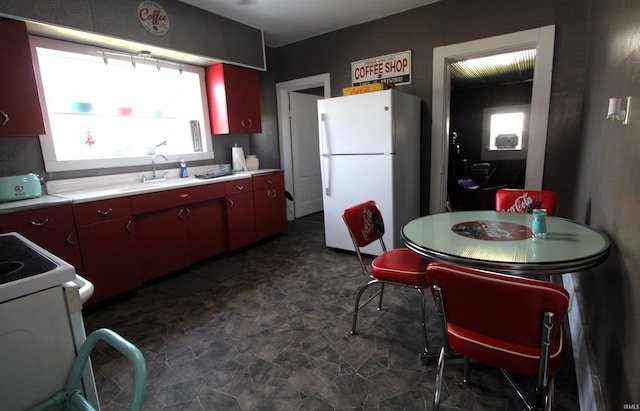 kitchen featuring sink and white appliances