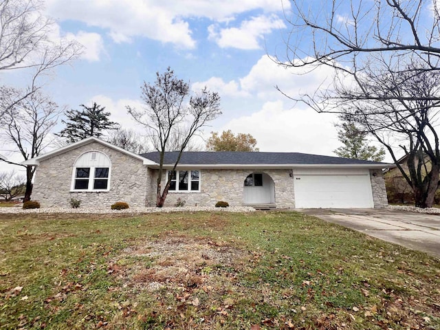 ranch-style house with a garage and a front lawn