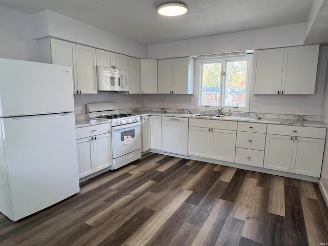 kitchen featuring sink, white cabinets, dark wood-type flooring, and white appliances