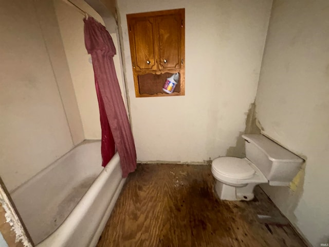 bathroom with shower / bath combo with shower curtain, toilet, and wood-type flooring