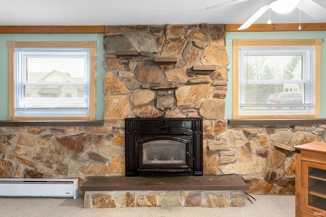 details featuring ceiling fan, carpet floors, and a baseboard radiator