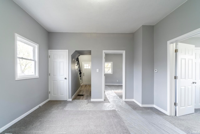 interior space featuring light carpet