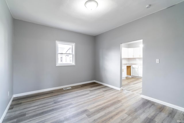 empty room with light wood-type flooring