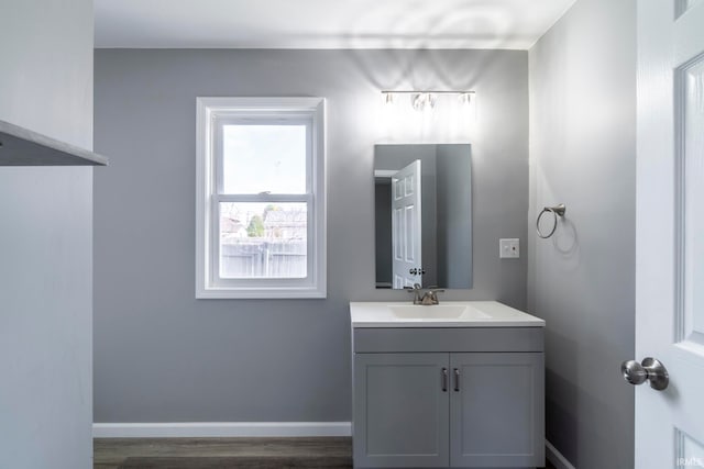 bathroom featuring vanity and hardwood / wood-style flooring