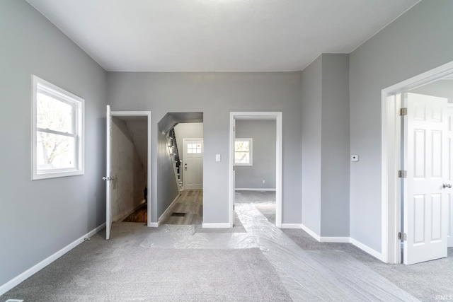 unfurnished bedroom with light carpet