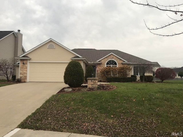 ranch-style home featuring a front lawn and a garage