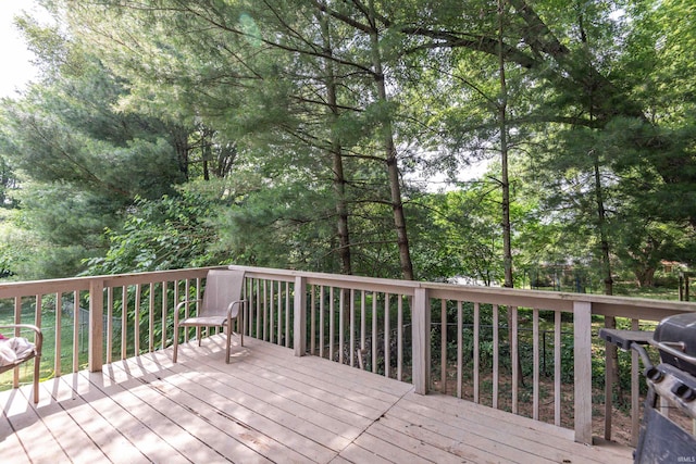 wooden deck with a grill