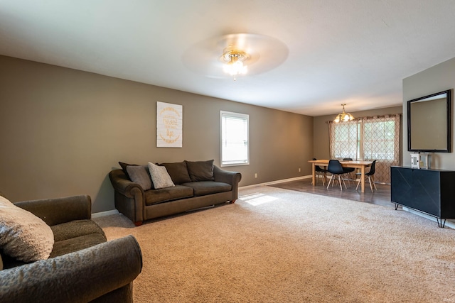 carpeted living room featuring ceiling fan