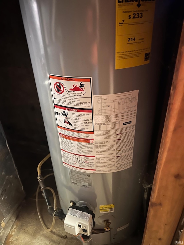 interior details featuring concrete flooring and water heater