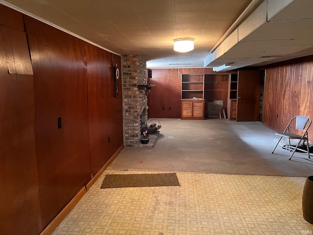 hallway featuring wooden walls