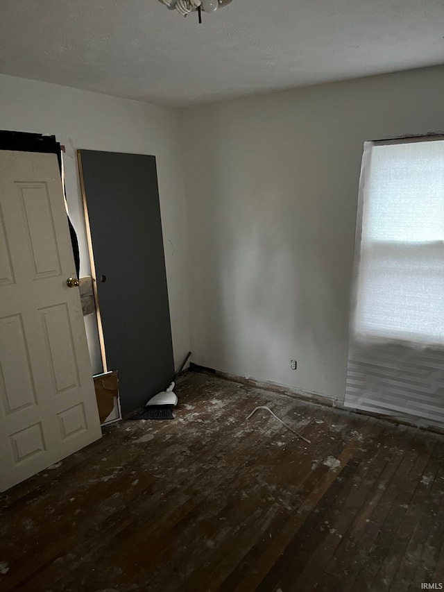 1614 N Johnson St, South Bend, IN 46628 - spare room with hardwood / wood-style flooring