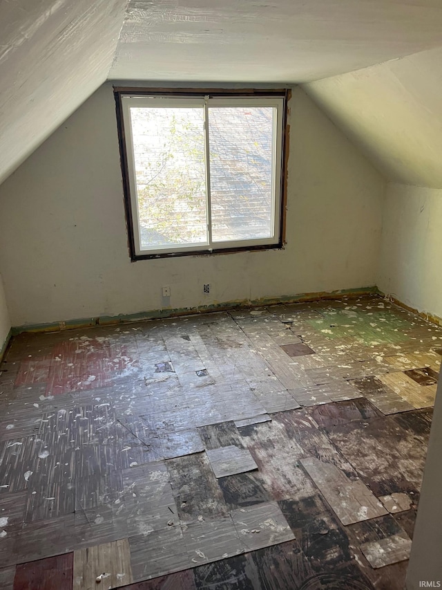 additional living space featuring vaulted ceiling