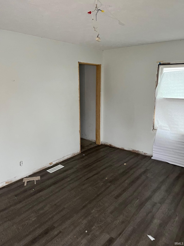 1614 N Johnson St, South Bend, IN 46628 - empty room featuring wood finished floors