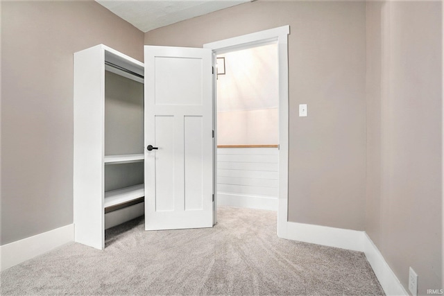 unfurnished bedroom featuring light colored carpet