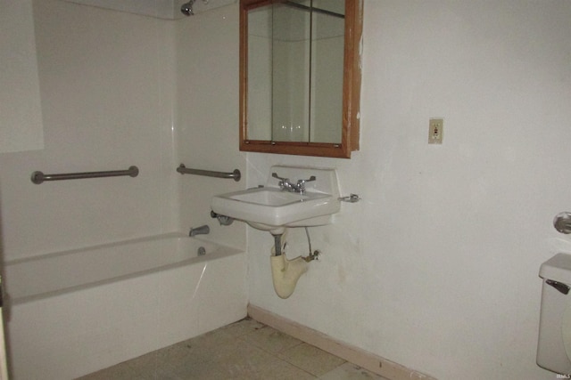 bathroom featuring shower / bath combination and sink