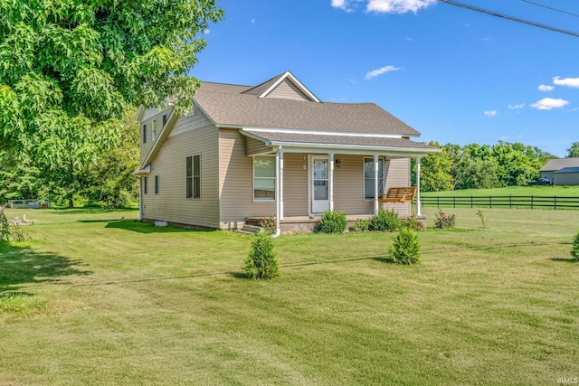 view of front of house with a front yard and a porch