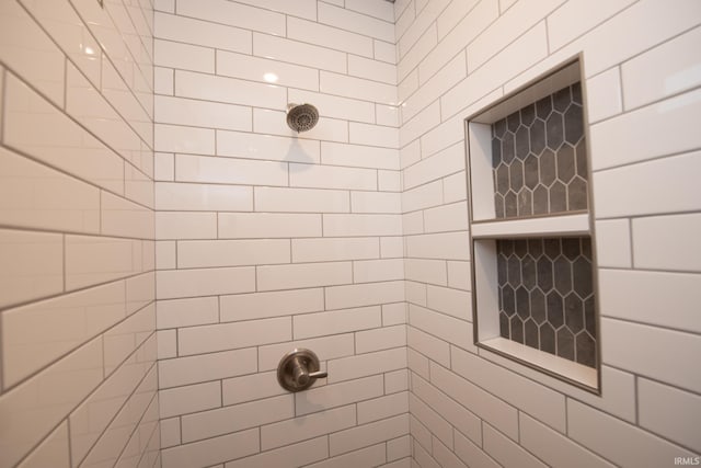 bathroom featuring tiled shower